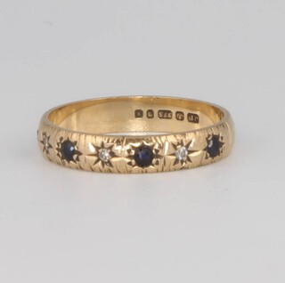 A 9ct yellow gold sapphire and diamond ring, size L 1/2, 1.9 grams