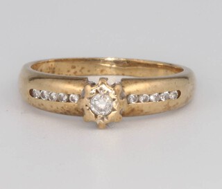 A 9ct yellow gold diamond ring, size K, 2.5 grams