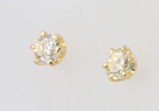 A pair of 18ct yellow gold diamond brilliant cut ear studs, approx, 0.57ct