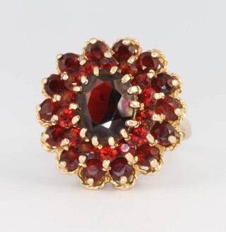 A 9ct yellow gold garnet cluster ring, size N, 6.4 grams 