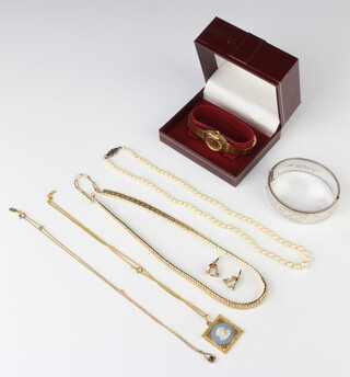 A lady's gilt Rotary wristwatch, a silver bangle and minor jewellery 