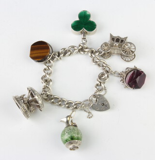 A silver charm bracelet 83 g gross