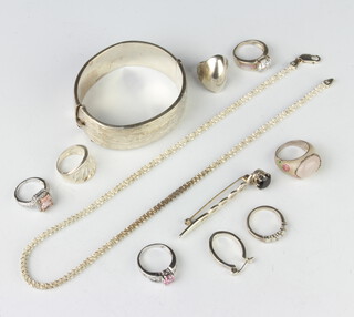 A silver bangle and minor silver jewellery, 100 grams