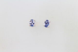 A pair of silver and tanzanite ear studs 