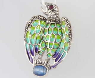 A silver enamelled marcasite and cabochon sapphire and ruby bird brooch 