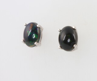 A pair of silver black Ethiopian ear studs 