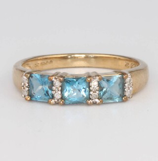 A 9ct yellow gold blue topaz and diamond ring, size O, 2.4 grams