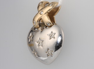 A 9ct white and yellow gold diamond set heart pendant, 5.8 grams 