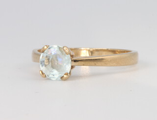 A 9ct yellow gold aquamarine ring, size N, 1.9 grams