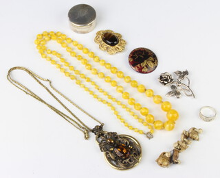An 800 standard silver pill box and minor costume jewellery 