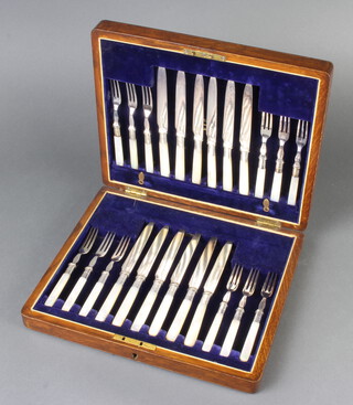 An Edwardian cased canteen of plated dessert eaters for 12 with mother of pearl handles