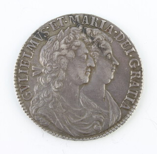 A William and Mary half crown (1688-1694) dated 1689, their conjoined busts facing right, the reverse with second crowned shield 