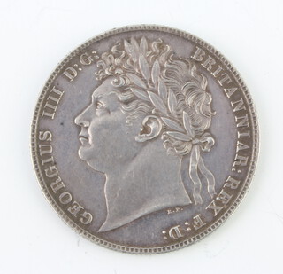 A George IV 1824 half crown, laureate head facing left, the reverse crowned and ornate garnished shield 