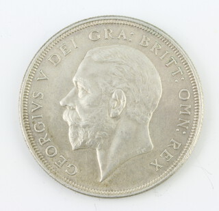 A George V proof crown 1928, modified bare head, the reverse with crown and date in wreath 