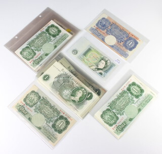 Thirty six one pound bank notes and a Gibraltar five pound note