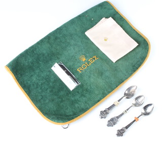 A Rolex golf ball cleaner, handkerchief, divot repairer and 10 tea spoons