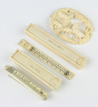 A 19th Century ivory thermometer in a rectangular box 9cm, ditto folding measure 7cm and a Victorian carved brooch 
