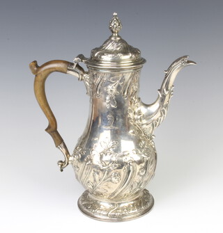 A good George III baluster repousse coffee pot, later decorated with scrolling flowers, with 2 engraved armorials and a fruitwood handle, London 1763 maker Benjamin Godfrey, 997 grams gross, 30cm 