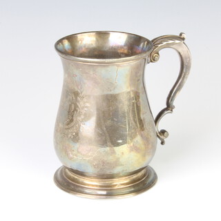 A George II silver baluster mug with fancy S scroll handle, engraved a double armorial, London 1737, maker Thomas Whipham, engraved presentation inscription to the base 13cm, 419 grams