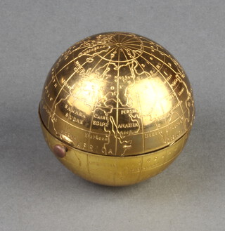 A novelty gilt compact in the form of a globe 4.5cm 