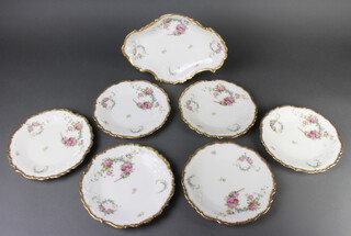 A Limoges part dessert service comprising 6 plates and a shaped dish 