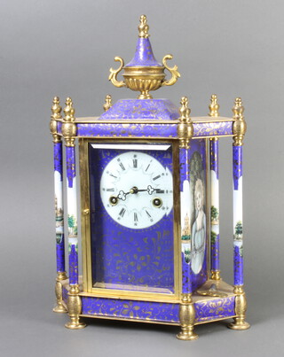 A reproduction French 19th Century 8 day striking mantel clock with enamelled dial and Roman numerals, contained in a gilt metal and enamel lozenge shaped case surmounted by a lidded urn, striking on a gong, 45cm h x 30cm w x 16cm d