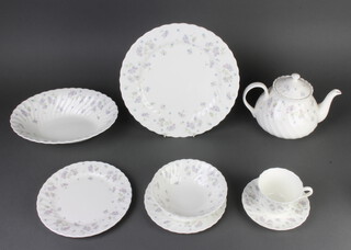 A Wedgwood April Flowers tea and dinner service comprising 8 tea cups, 8 saucers, 8 small plates, 6 dessert bowls, coffee pot, tea pot, cream jug, sugar bowl, 8 two handled cups, 9 saucers, 8 dinner plates, sauce boat, 2 bowls, a tureen and cover and an oval meat plate 
