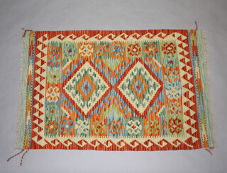 A yellow and green ground wool Chobi Kilim rug with 2 diamonds to the centre 120cm x 79cm  