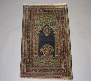 A blue and green ground Persian Prayer rug within multi row border 133cm x 80cm 