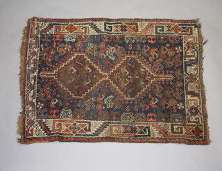 A blue and red ground Persian slip rug with 2 stylised medallions to the centre 123cm x 87cm 