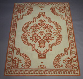A Patrick Fryer Collection machine made cream and orange ground rug with central medallion 170cm x 230cm  