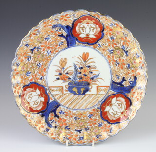 A Imari scalloped dish with panels of flowers 30cm 