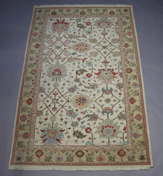 A white ground and floral patterned Caucasian style carpet 261cm x 180cm 