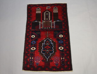 A Belouche pictorial rug decorated buildings 141cm x 85cm 