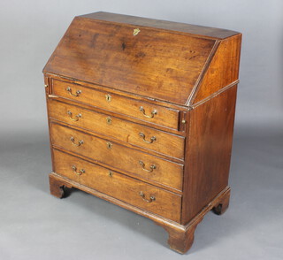 A Georgian mahogany bureau, the fall front revealing a well fitted interior above 4 long drawers 109cm h x 96cm w x 51cm d 