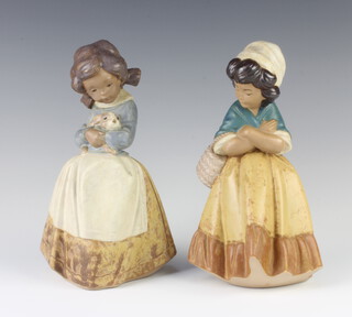 Two Lladro matt figures of girls, 1 holding a rabbit 2094, 21cm, another carrying a basket 21cm 