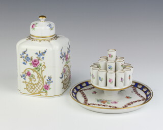 A modern Dresden tea caddy decorated with flowers 13cm, a ditto candle holder 14cm  