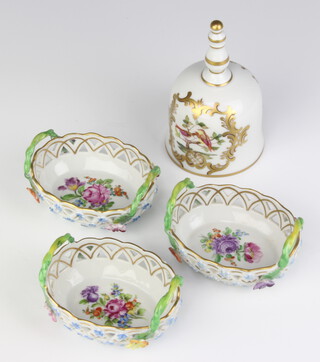 Three modern Dresden baskets decorated with flowers 8cm together with a ditto hand bell decorated with exotic birds 11cm 
