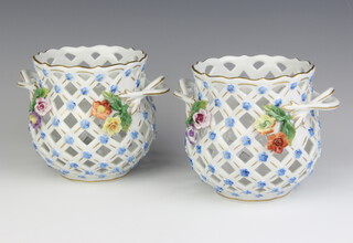 A pair of modern Dresden pierced baskets encrusted with flowers with rustic handles 11cm 
