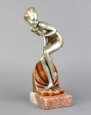 An Art Deco style resin figure of a crouching girl, raised on a 2 colour marble base 25cm x 8.5cm x 10cm 