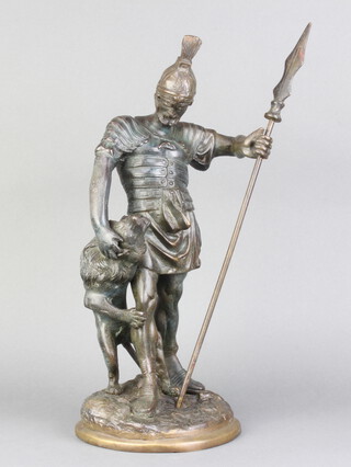 A bronze figure of a standing Greek Warrior with spear and wolf, raised on a circular base 40cm h x 17cm diam. 
