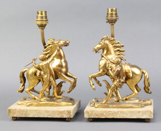 After Coustou, a pair of gilt bronze figures of Marli horses, converted to electric table lamps, raised on marble bases 27cm h x 16cm w x 12cm d 
