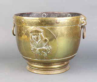 A brass twin handled jardiniere with mask ring drop handles 23cm x 30cm 