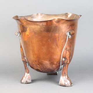 An Edwardian Liberty style cylindrical copper jardiniere with wavy border, raised on panel supports, the base marked RD403904  27cm h x 29cm diam. 