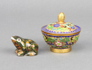 A circular champleve enamel jar and cover 5cm x 5cm together with a cloisonne enamel figure of a seated toad 3cm x 3m 