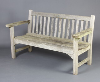 HMS Arethusa, a teak slatted garden bench formed from timbers from the ship with metal plaque reading - launched 1849 in Odessa, broken up in 1933 in Sebastopol, 84cm h x 153cm w x 62cm d 