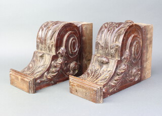 A pair of Victorian carved mahogany vitruvian style scrolls 33cm x 21cm x 14cm 