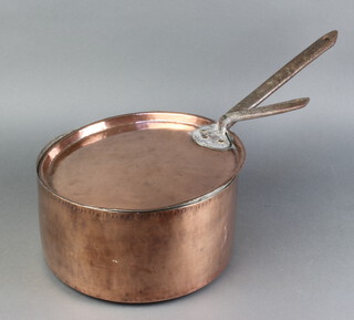 A circular copper saucepan with lid and iron handle 16cm x 29cm 