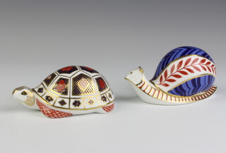 A Royal Crown Derby Imari pattern paperweight in the form of a snail with a ceramic stopper 12cm, a ditto of a tortoise with a ceramic stopper 11cm 