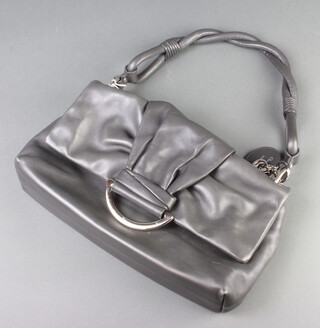 Christian Dior, a lady's grey soft leather handbag with silvered clasp marked Dior, and silver coloured Dior letters, the interior labelled Christian Dior Paris, Made in Italy and numbered to the reverse 07-MA-0079,20cm x 32cm x 7cm 